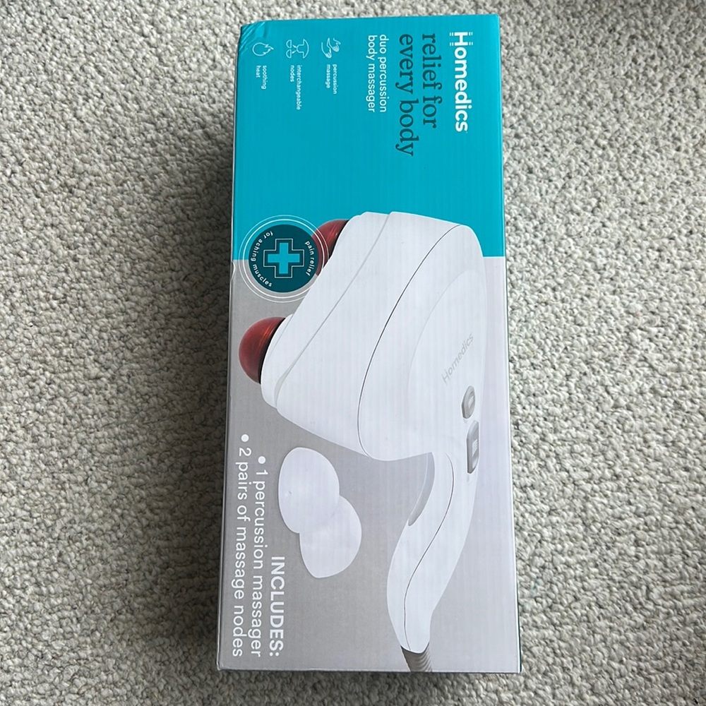 Homeric massage machine, brand new never been open.